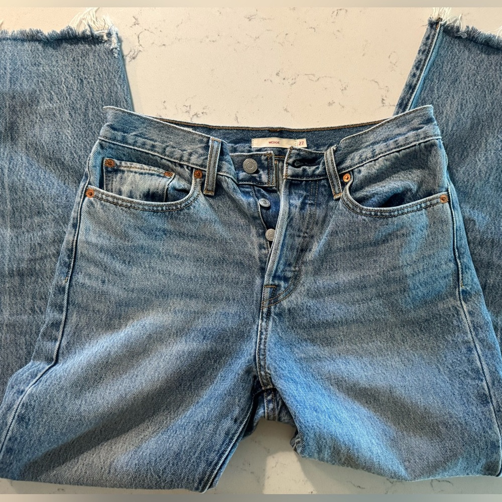 Levi jeans— button fly, raw hem